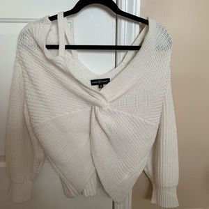 Cold shoulder front twist sweater